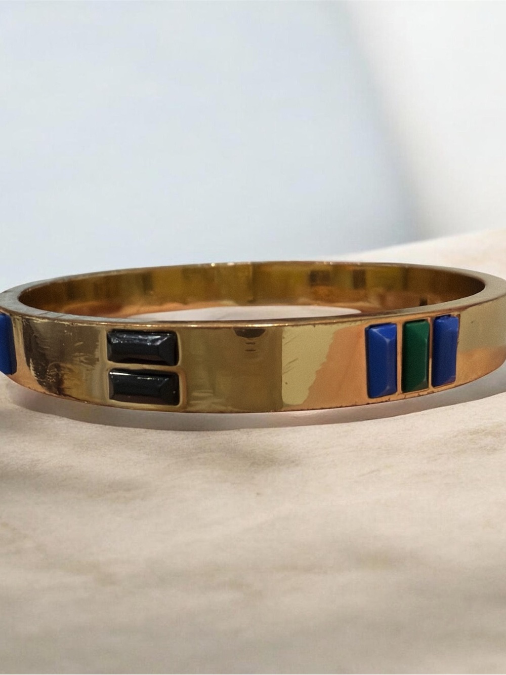 Gold Tone Bangle Bracelet with Blue, Green, and Black Accents